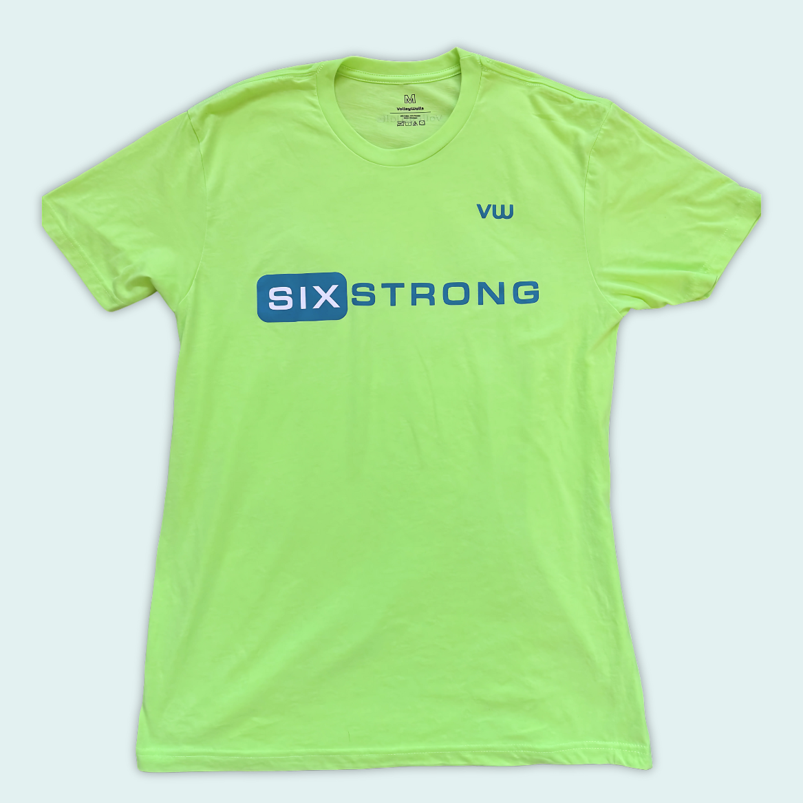 Lime green-yellow t-shirt with dark green 'Six Strong' t-text across the front and a dark green VW logo on left chest