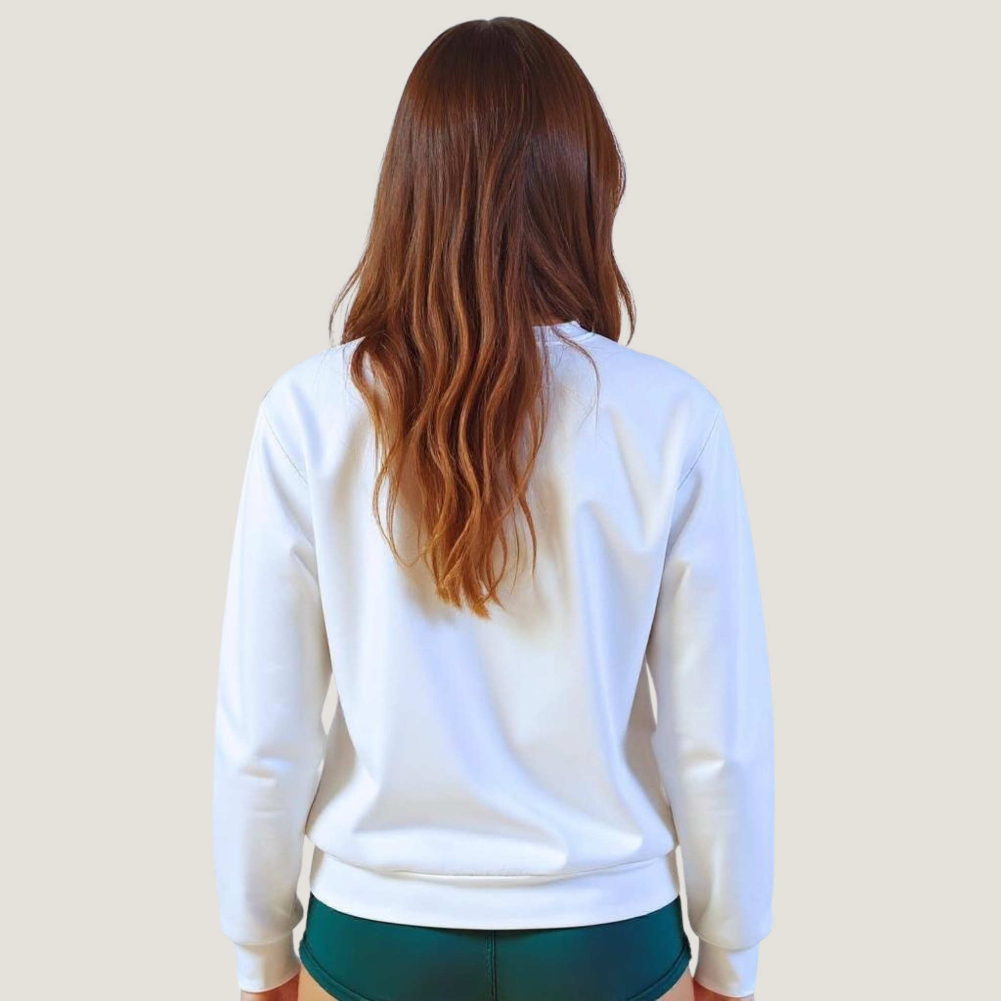 Female wearing a white sweatshirt with no text logos or images on the back.